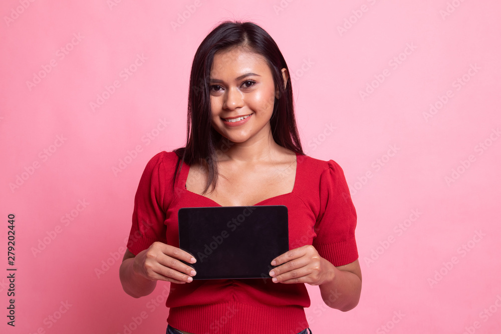 Young Asian woman with a computer tablet. Young Asian woman with a computer tablet.