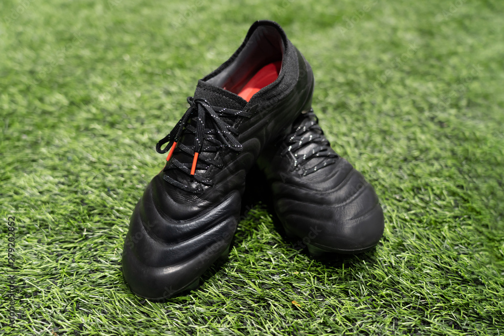 football stud shoes on artificial grass field football stud shoes on artificial grass field