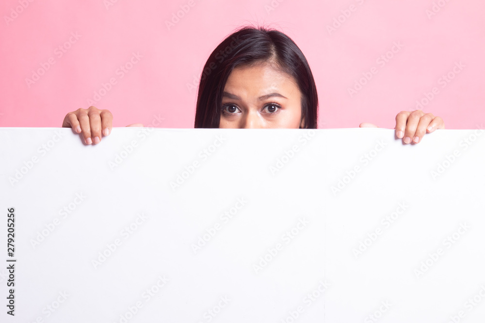 Close up of young Asian woman behind a blank sign. Close up of young Asian woman behind a blank sign.