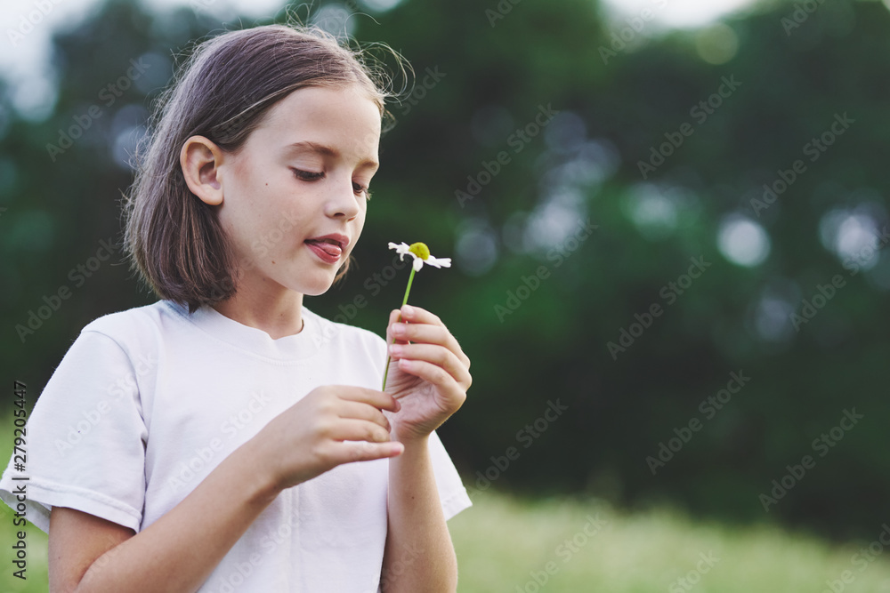 young woman blowing bubbles in the park