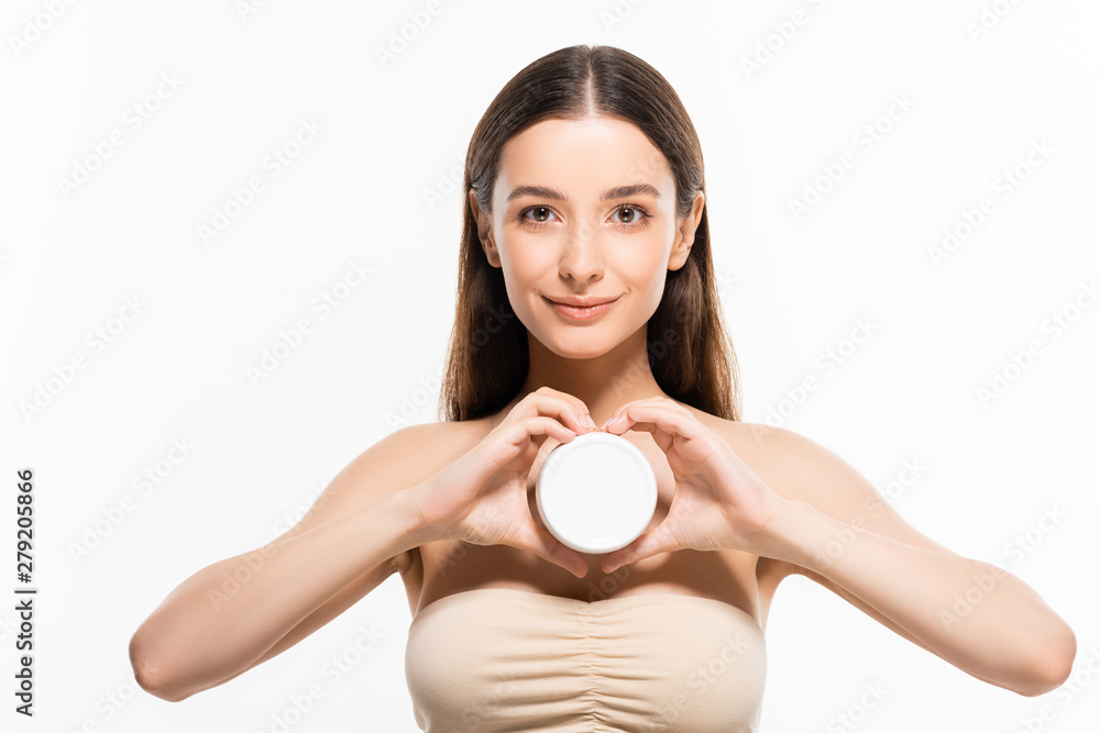beautiful young woman with perfect skin holding cosmetic cream and showing heart gesture isolated on white beautiful young woman with perfect skin holding cosmetic cream and showing heart gesture isolated on white