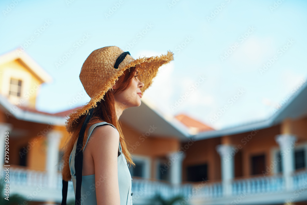 woman in hat on beach