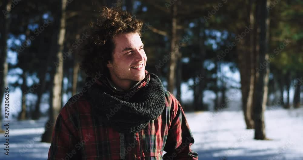 Portrait of a tourist in front of the camera enjoying the time while traveling alone very charismatic feeling excited in a winter day Portrait of a tourist in front of the camera enjoying the time while traveling alone very charismatic feeling excited in a winter day