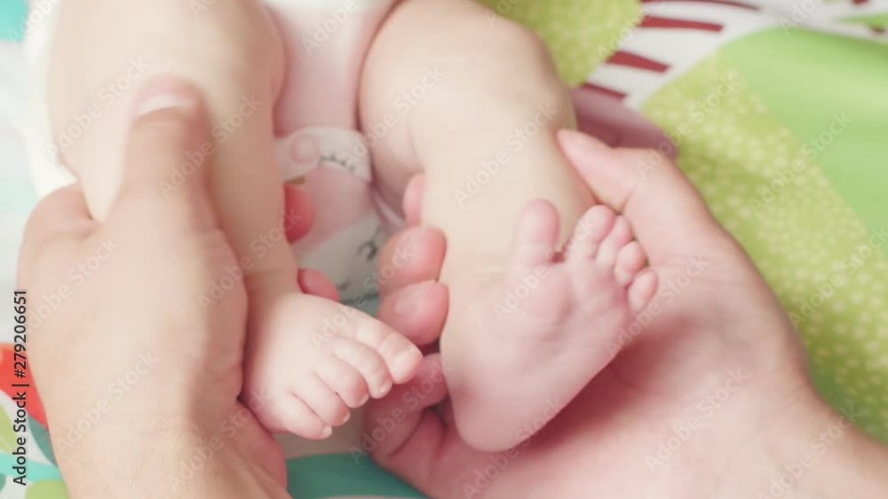 Dad plays with newborn daughterat the age of two months old. Baby, family, love, relationship, parenting concept Dad plays with newborn daughterat the age of two months old. Baby, family, love, relationship, parenting concept