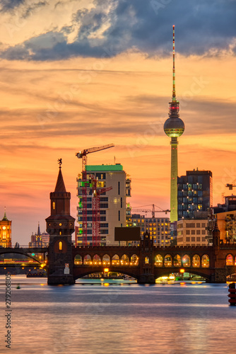 Dramatic sunset at the Oberbaum Bridge and the famous Television Tower in Berlin 