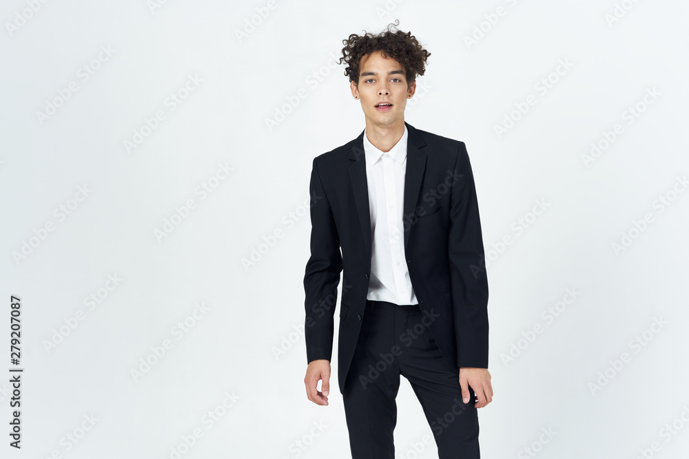 portrait of a businessman standing with hands in pockets portrait of a businessman standing with hands in pockets