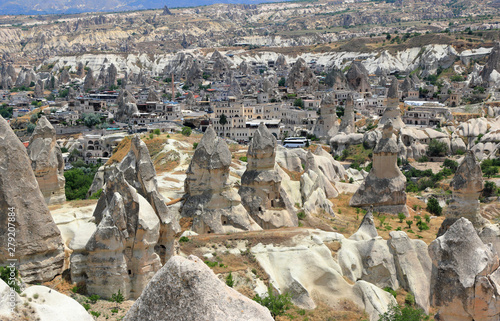 The town Göreme with rock houses in front of the spectacularly coloured valleys nearby. Cappadocia, Central Anatolia, Turkey.