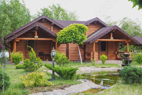 Country cottages with log and timber in the green area. cozy eco-friendly houses made of natural wood, bungalows for families