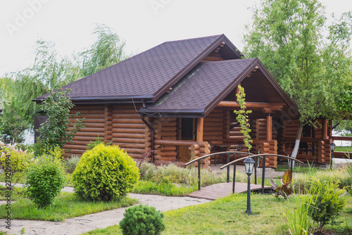 Country cottages with log and timber in the green area. cozy eco-friendly houses made of natural wood, bungalows for families