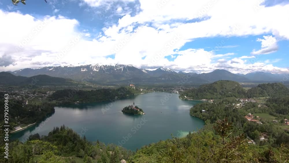 Right pan view of lake Bled with snow and clouds covered Alps from Osojnica hill Right pan view of lake Bled with snow and clouds covered Alps from Osojnica hill