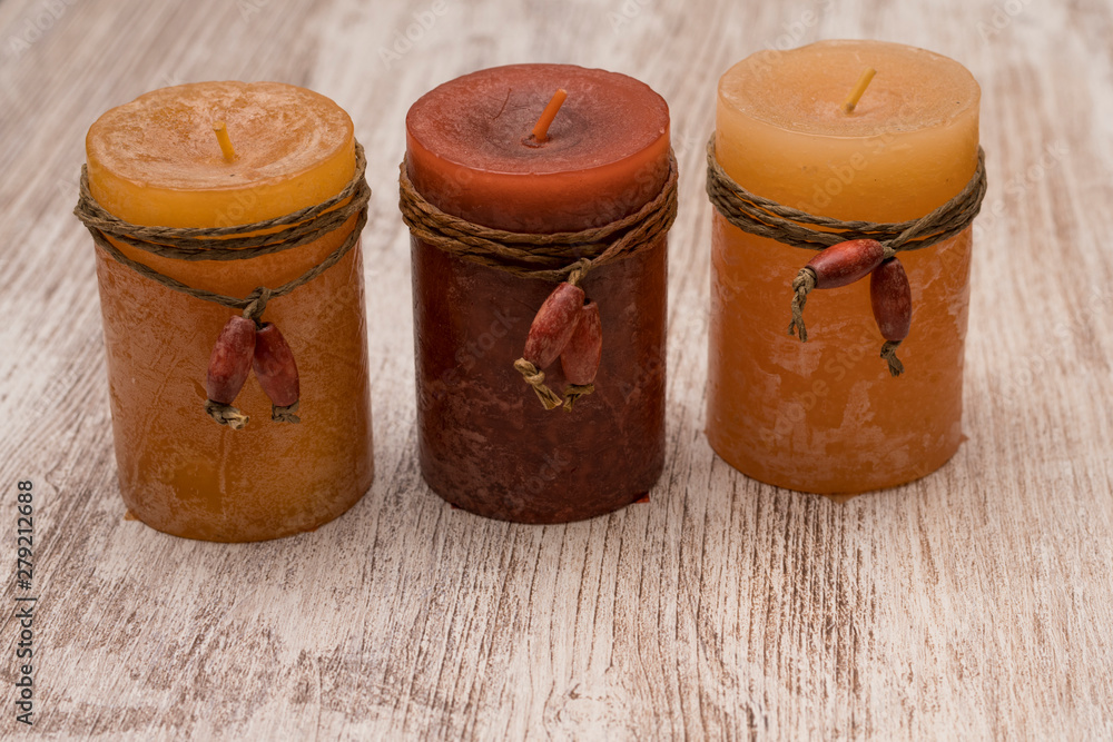 Romantic and scented candles on old wooden background Romantic and scented candles on old wooden background