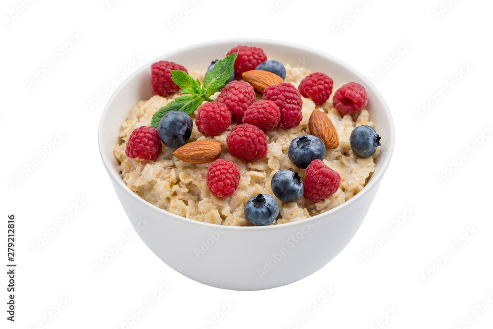 Oatmeal with raspberries, almonds and blueberries and mint isolated on white Oatmeal with raspberries, almonds and blueberries and mint isolated on white
