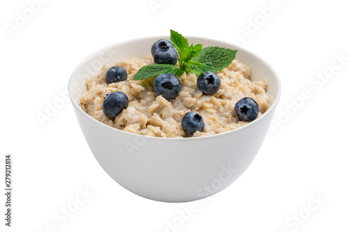 Oatmeal porridge with blueberries and mint isolated