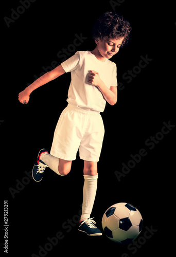 Soccer, action, ball. Portrait of soccer player hitting the ball. Isolated on black background