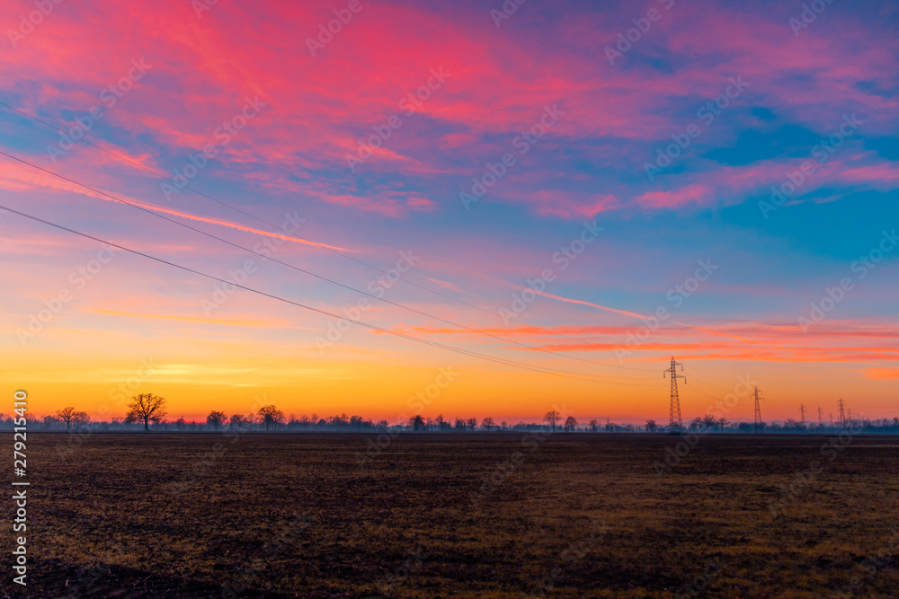 Fototapeta premium Colorful sunset over field