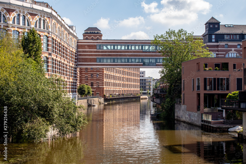 Obraz premium View from the river Weisse Elster in Leipzig,Germany. It is a popular place to live in wonderful architecture in old Factory buildings . This is a beautiful place to live and for water sports.