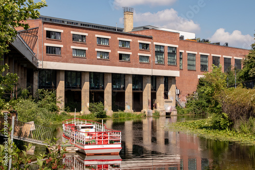 Picture of the Karl Heine canal in Leipzig between the city and Lindenau harbor. In the background the so-called Stelzenhaus an old industrial building used today for office and restaurant