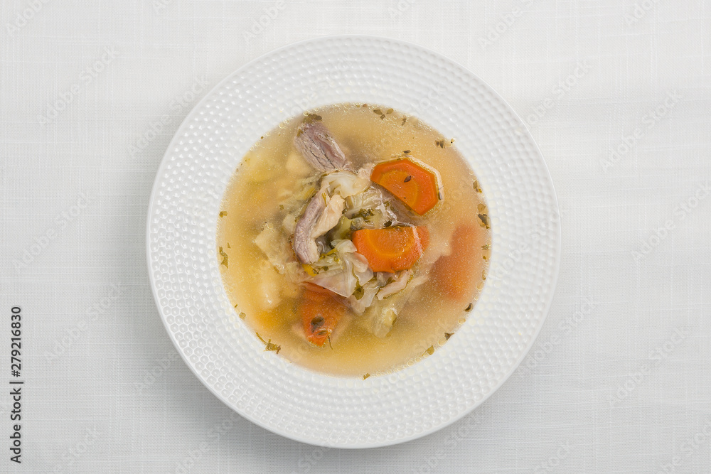Vegetable soup with meat on white background. Top view. Vegetable soup with meat on white background. Top view.