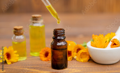 The calendula extract. Medicinal plants. Selective focus. photo