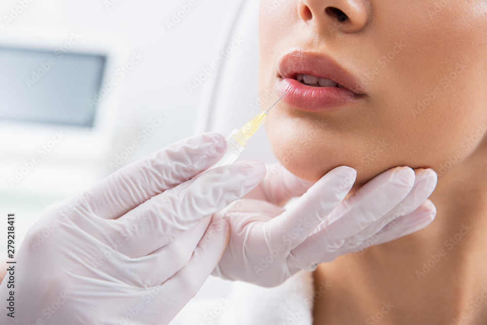Sensual lady on procedure for lips in salon Sensual lady on procedure for lips in salon