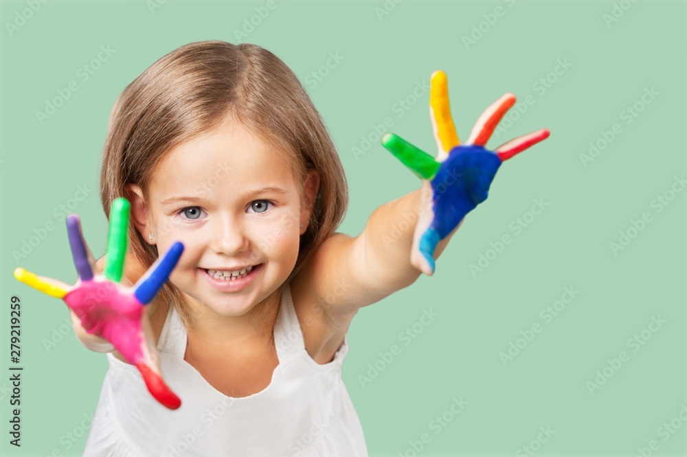 Cute little girl with colorful painted hands on background Cute little girl with colorful painted hands on background