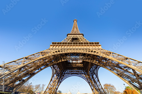 Up view of the Eiffel tower at the early morning with a clear and cloudless sky
