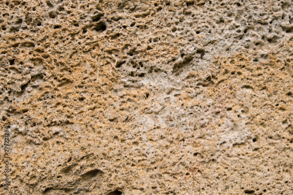 Background of old stone. Limestone is a sedimentary, detrital rock of organic, less often chemogenic origin, consisting of calcium carbonate (CaCO3) in the form of calcite crystals. Background of old stone. Limestone is a sedimentary, detrital rock of organic, less often chemogenic origin, consisting of calcium carbonate (CaCO3) in the form of calcite crystals.