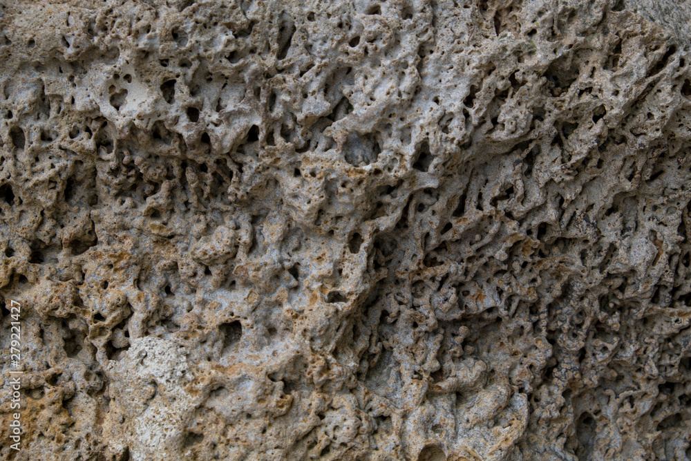 Background of old stone. Limestone is a sedimentary, detrital rock of organic, less often chemogenic origin, consisting of calcium carbonate (CaCO3) in the form of calcite crystals. Background of old stone. Limestone is a sedimentary, detrital rock of organic, less often chemogenic origin, consisting of calcium carbonate (CaCO3) in the form of calcite crystals.