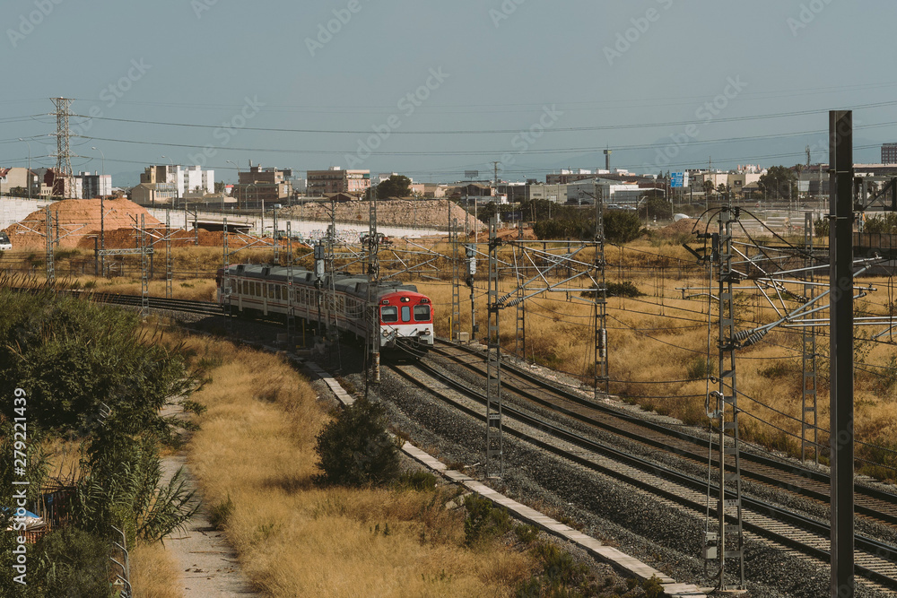 Train approaching. Locomotive on railway lines. Electric train at countryside. Spain Train approaching. Locomotive on railway lines. Electric train at countryside. Spain