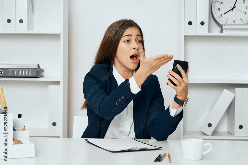 businesswoman talking on phone in office businesswoman talking on phone in office