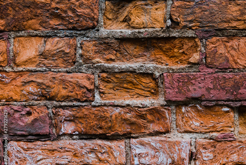 Beautiful, old wall of ancient, dilapidated brick. Background, which is 300 years old. Very durable building material. photo