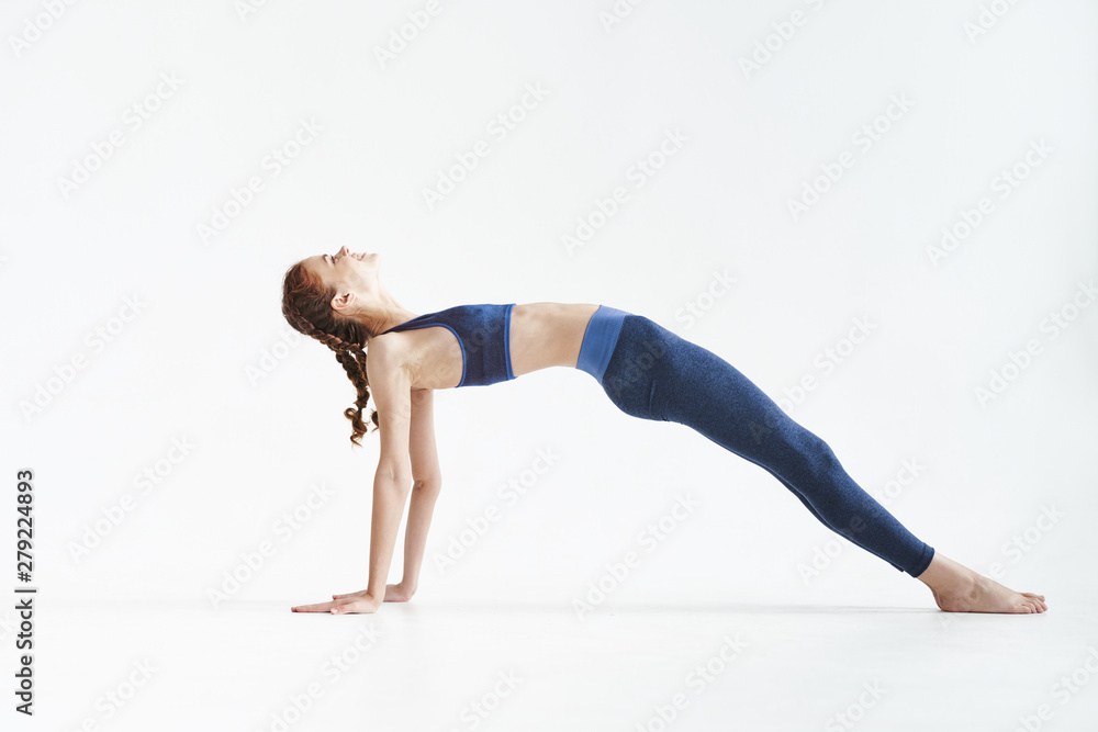 young woman doing stretching exercise young woman doing stretching exercise