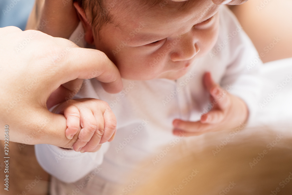 infant newborn baby dressed in white infant newborn baby dressed in white