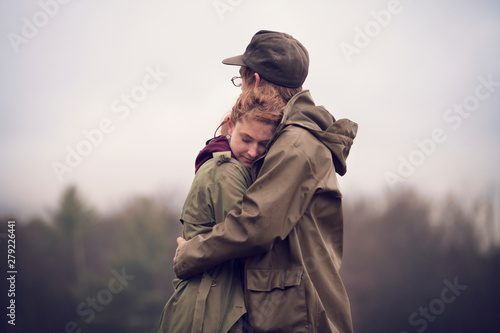 Photography Young hikers embracing