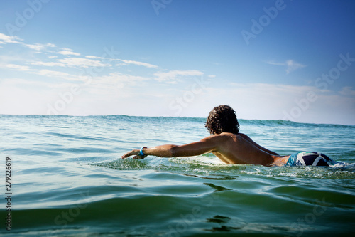 Photography Shirtless man surfing in sea