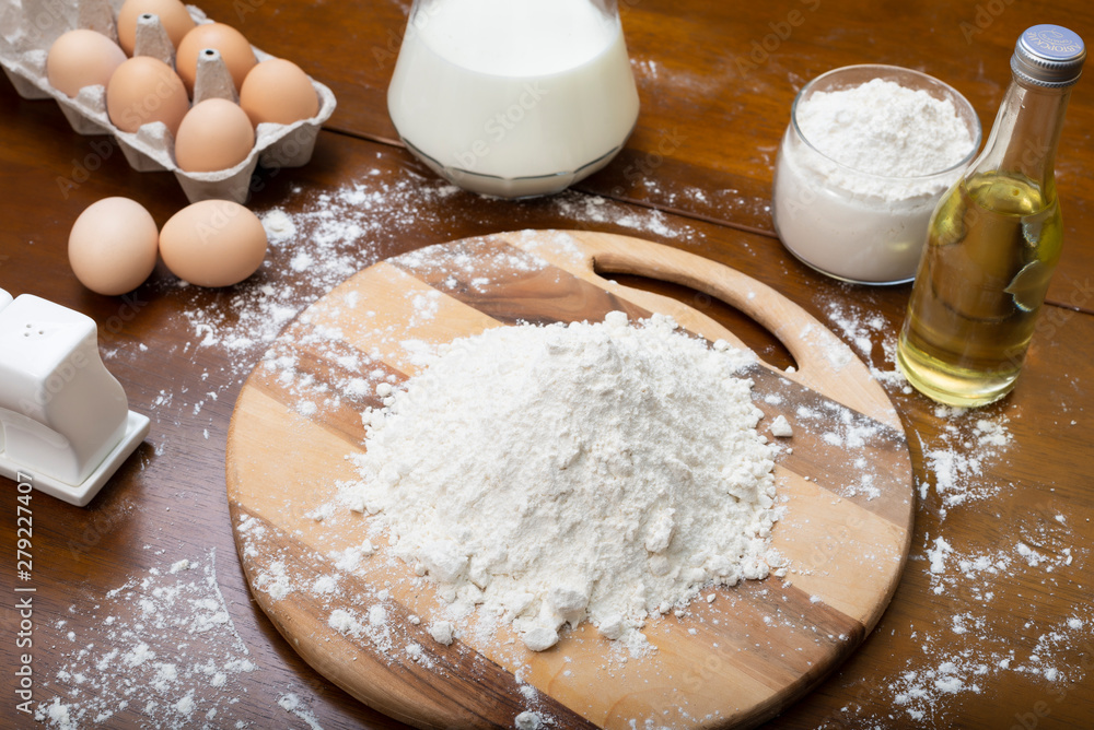 Making dough from eggs and milk. Cooking and home concept Making dough from eggs and milk. Cooking and home concept