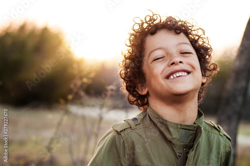 Εκτύπωση καμβά Portrait of boy (6-7) smiling in meadow