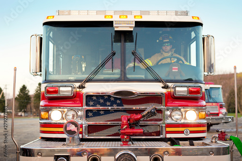 Фотография Firefighter driving fire engine