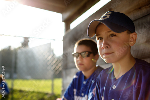 Photography Baseball players sitting in dugout