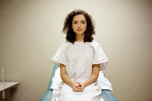 Slika na platnu Portrait of patient sitting on hospital bed