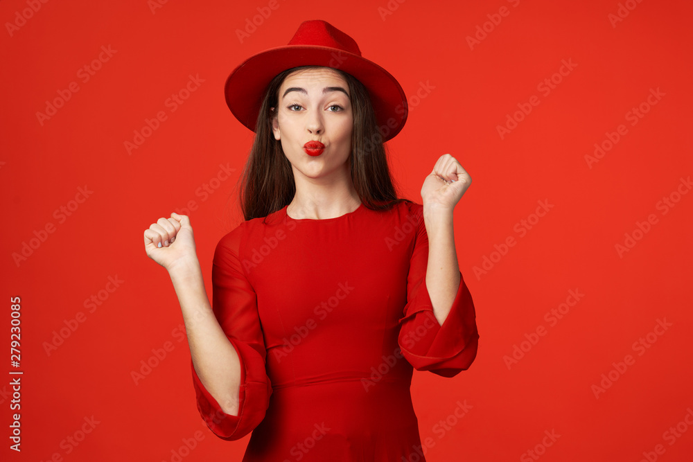 portrait of young woman in red hat portrait of young woman in red hat