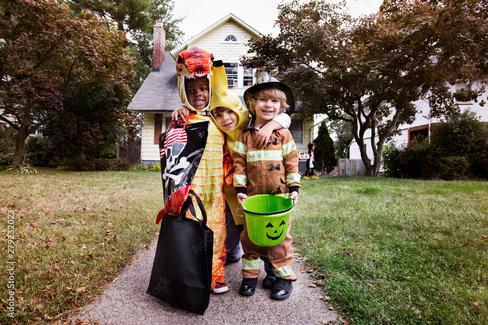 Fototapeta premium Portrait of smiling children in costumes during Halloween
