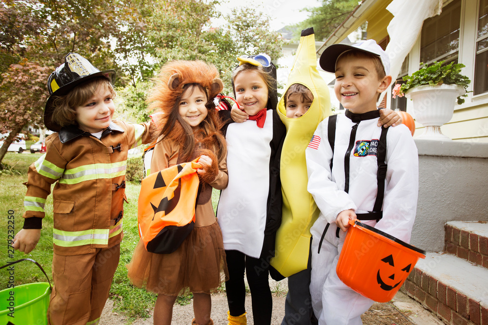 Fototapeta premium Portrait of smiling children in costumes during Halloween