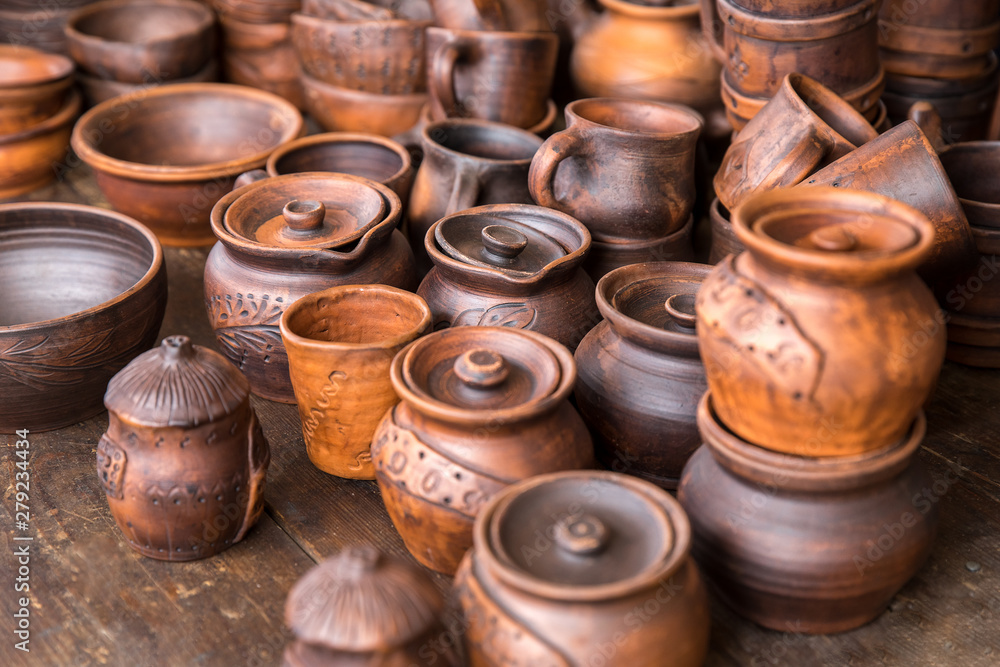 Pottery: pots and cups at the exhibition. The concept of the fair, handmade art and craft. Pottery: pots and cups at the exhibition. The concept of the fair, handmade art and craft.
