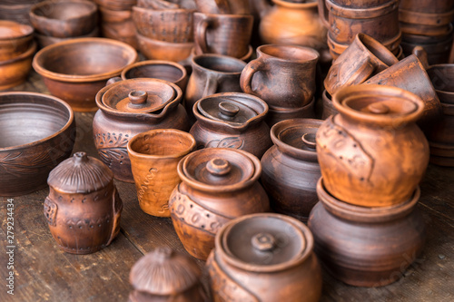 Pottery: pots and cups at the exhibition. The concept of the fair, handmade art and craft. © amtiko
