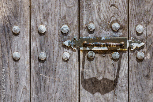 Abstract design of a face (animal or human), formed by a door handle and it's shadow © fotorauschen