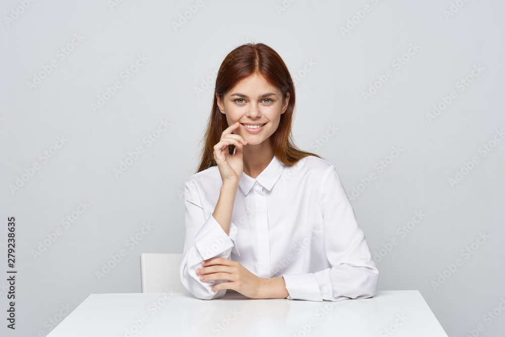 businesswoman sitting at desk businesswoman sitting at desk