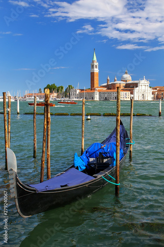 Gondola moored near San Marco square across from San Giorgio Maggiore island in Venice, Italy © donyanedomam