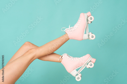 Quadro em tela Pink roller skates on the legs. Activity can be fun!