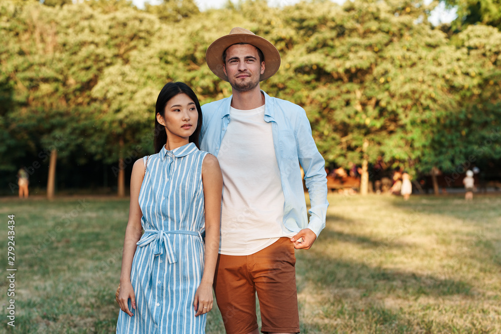 young couple walking in autumn park young couple walking in autumn park